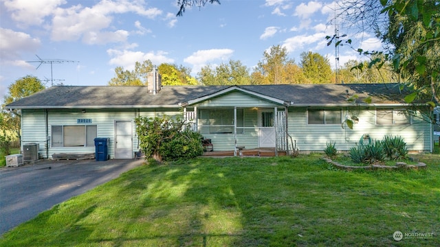 ranch-style house with a front lawn