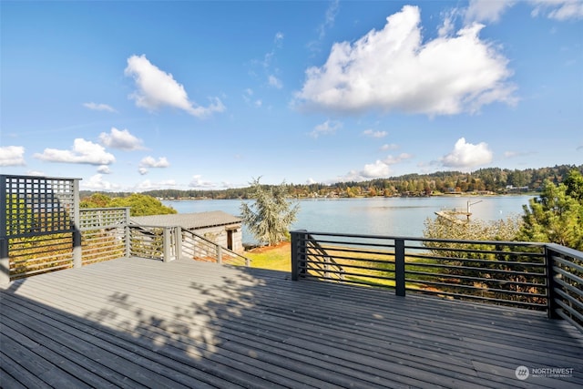 wooden deck featuring a water view