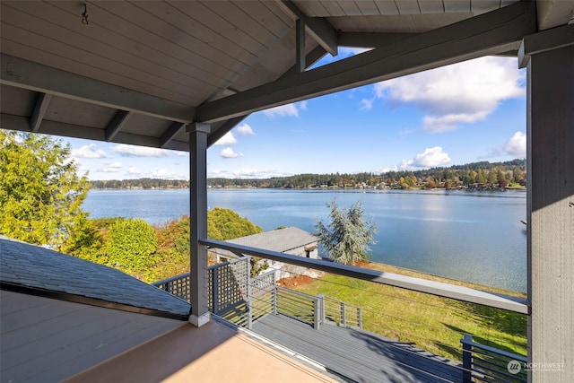 wooden terrace with a water view