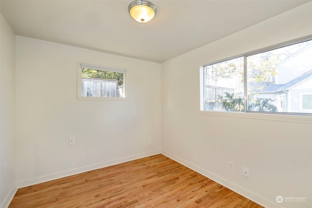 spare room with light wood-type flooring