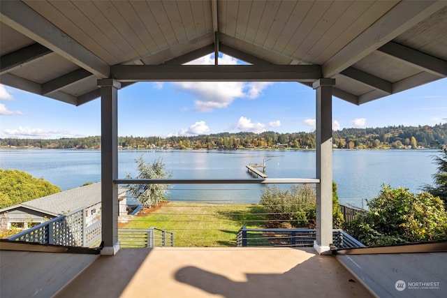 exterior space featuring a water view and a balcony