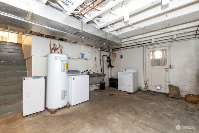 basement with independent washer and dryer and electric water heater