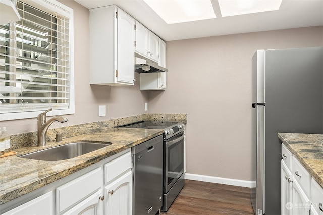 kitchen featuring white cabinets, light stone countertops, stainless steel appliances, dark wood-type flooring, and sink