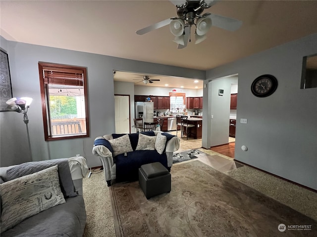 living room featuring hardwood / wood-style flooring and ceiling fan