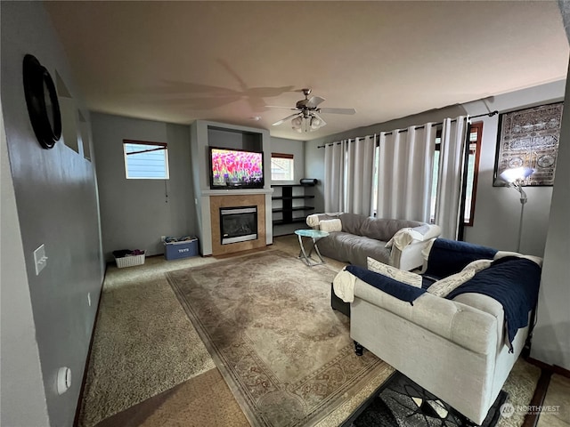 carpeted living room featuring ceiling fan