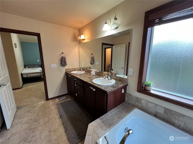 bathroom with vanity and a bathing tub