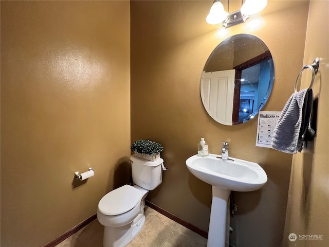 bathroom featuring tile patterned floors and toilet