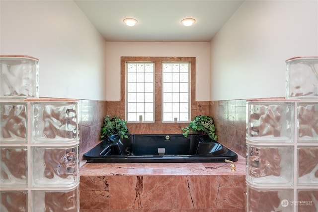 bathroom featuring tiled bath