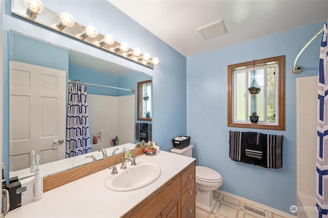 13629 Rector Rd, Bow, WA 98232 - bathroom with toilet, vanity, shower / bath combo, and baseboards