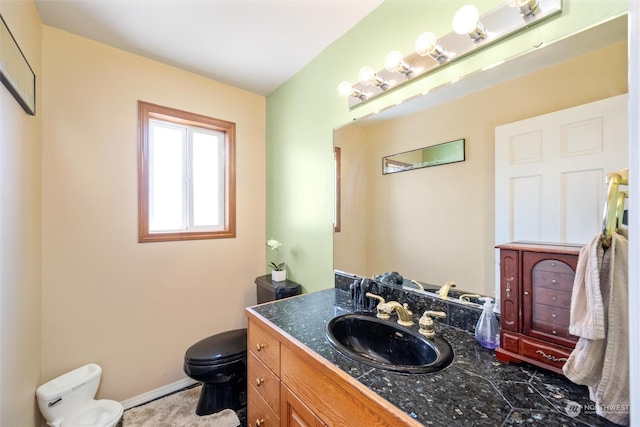 13629 Rector Rd, Bow, WA 98232 - bathroom featuring toilet, vanity, and baseboards