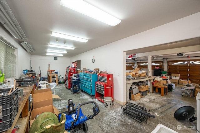 13629 Rector Rd, Bow, WA 98232 - garage with a garage door opener and a workshop area