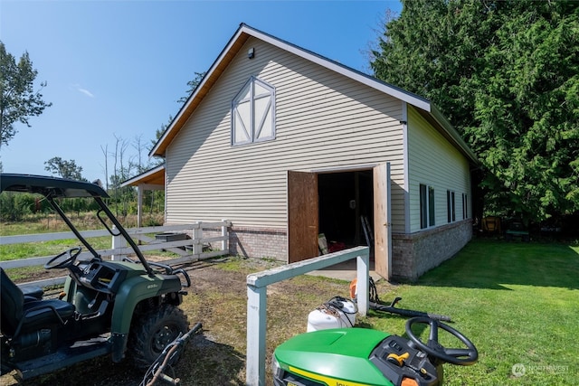 view of side of property with a yard