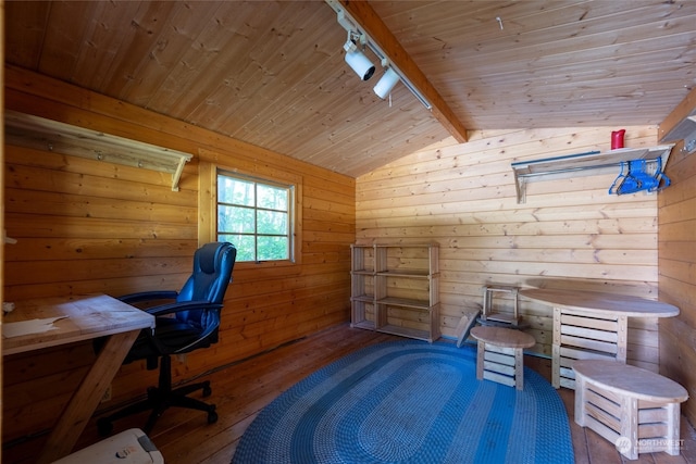 home office featuring track lighting, wood ceiling, wood-type flooring, lofted ceiling with beams, and wood walls