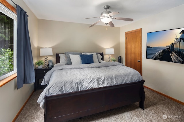 carpeted bedroom with ceiling fan