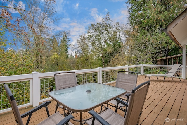 wooden deck with outdoor dining space