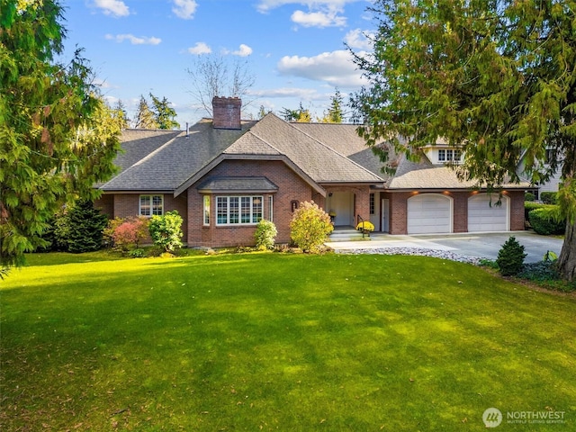 view of front of home featuring driveway, a garage, a chimney, roof with shingles, and a front yard