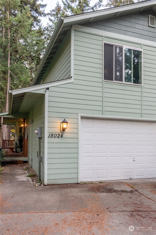 view of property exterior with a garage