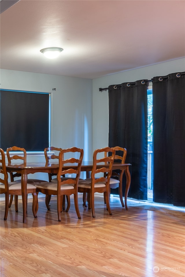 dining area with light hardwood / wood-style flooring