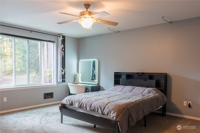 carpeted bedroom featuring ceiling fan