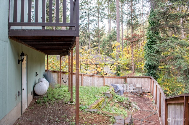 view of yard featuring a wooden deck