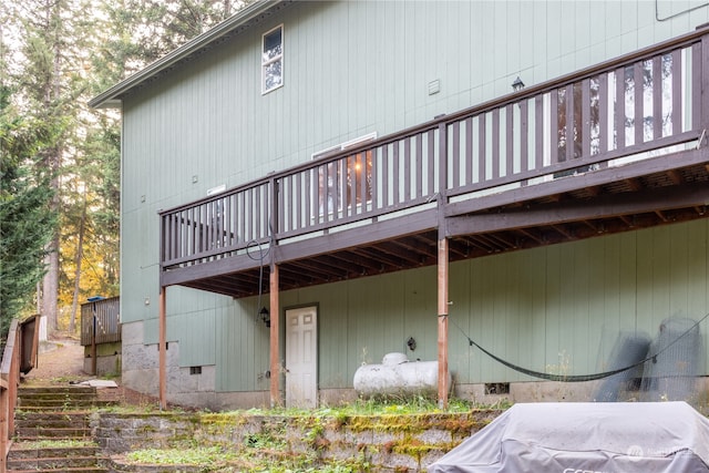 back of property featuring a deck