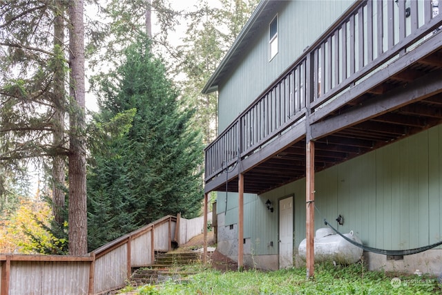 view of property exterior featuring a wooden deck