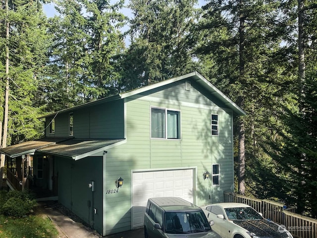 view of side of property with a garage