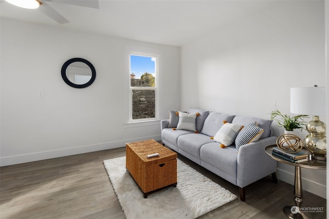 living room featuring hardwood / wood-style flooring and ceiling fan