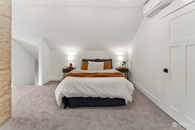 carpeted bedroom featuring an AC wall unit