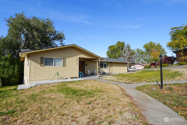 view of front of home with a front lawn