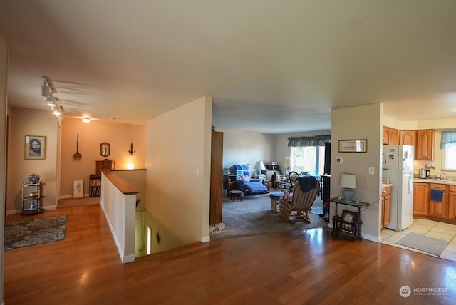 corridor featuring light hardwood / wood-style flooring