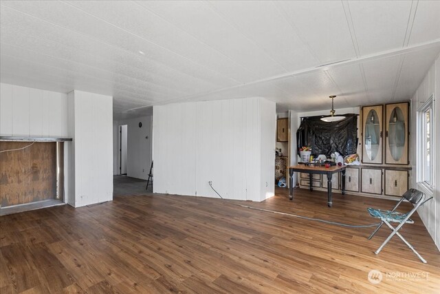 unfurnished living room featuring wood-type flooring