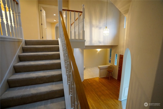 staircase featuring hardwood / wood-style floors