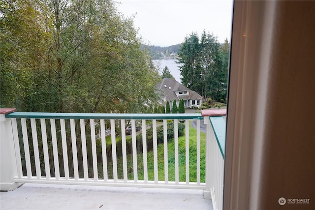 balcony featuring a water view