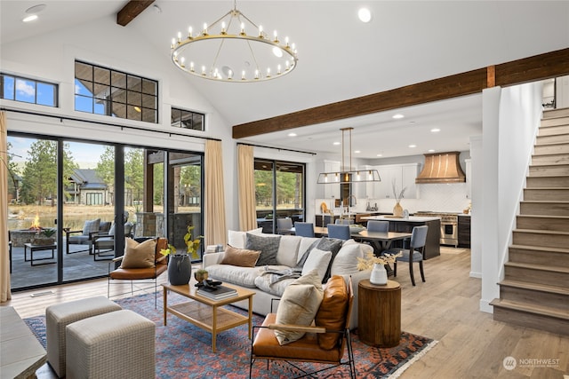 living room with beamed ceiling, high vaulted ceiling, light hardwood / wood-style floors, and an inviting chandelier