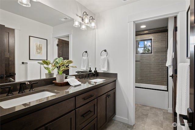 bathroom featuring vanity and combined bath / shower with glass door