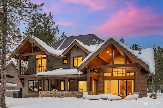 snow covered house with a balcony