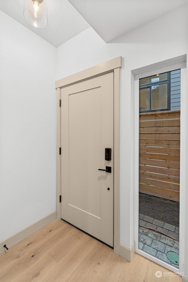 entryway with light hardwood / wood-style flooring