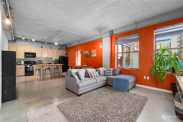 744 Market St Unit 302, Tacoma, WA 98402 - living area with baseboards and light speckled floor