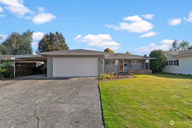 single story home featuring a garage, a front lawn, and a carport