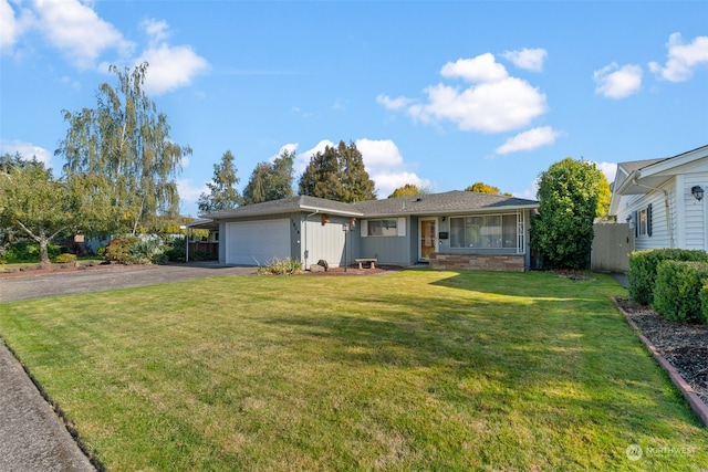 single story home with a front lawn and a garage