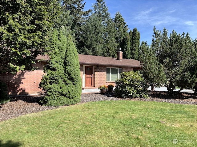 ranch-style house with a front yard