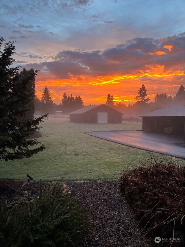 yard at dusk with a carport