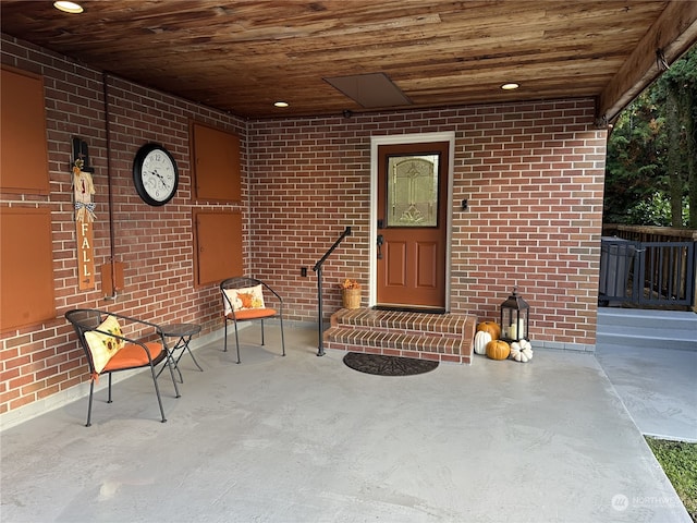 entrance to property featuring a patio