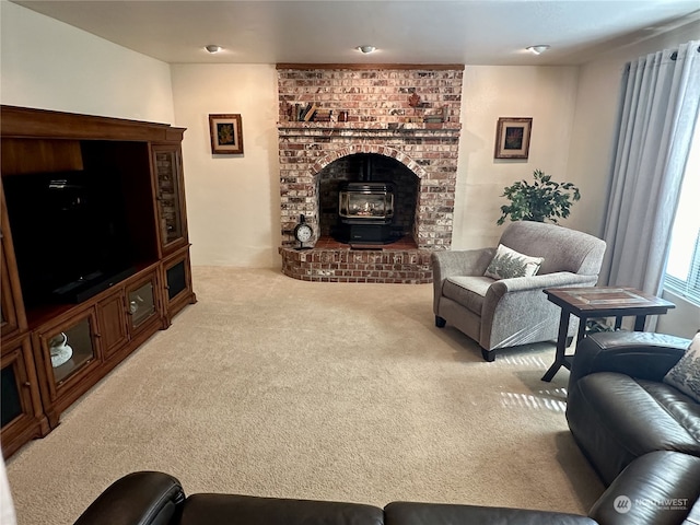 carpeted living room with a wood stove