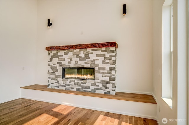 1819 Sam Benn Ln, Aberdeen, WA 98520 - detailed view of wood finished floors, a stone fireplace, and baseboards