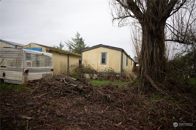7104 Ortelius Dr, Ilwaco, WA 98624 - view of side of property featuring an exterior structure and an outbuilding