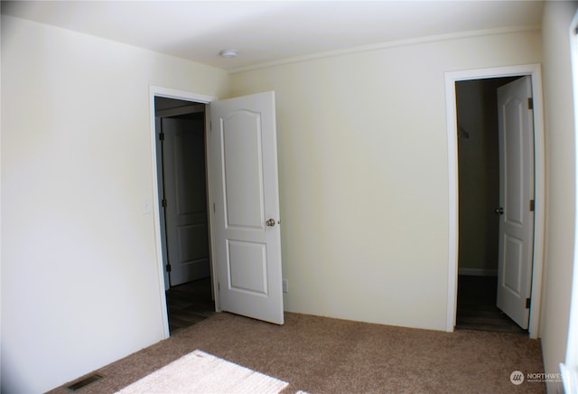 unfurnished bedroom with light carpet