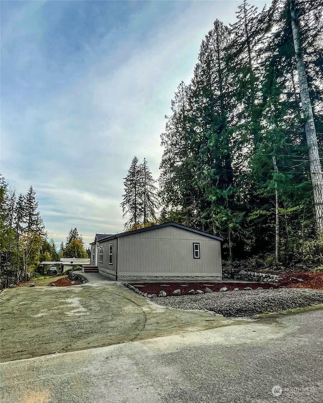 view of property exterior featuring a lawn