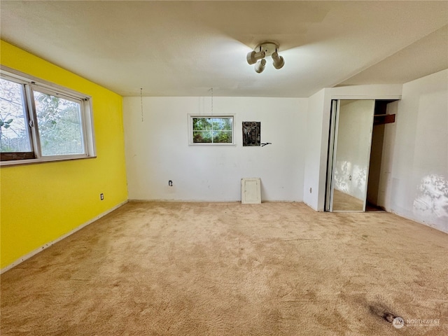 unfurnished bedroom featuring light colored carpet